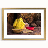 Textured abstract art print depicting Ethiopian scenery in earth tones, framed with a gold mat, suitable for bedroom decor.