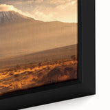 Extra large framed canvas featuring a textured depiction of a Kenyan scenery in black with colorful accents.