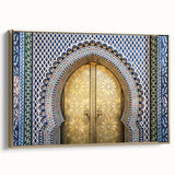 Framed canvas of a Moroccan landscape in vintage poster style, featuring a palette of gold and black.