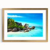 Abstract art print of Seychelles scenery in gold frame, featuring vibrant ocean and sky colors, ideal for dining room decor.