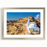 Textured abstract art print of a Tunisian landscape in muted earth tones, framed in silver, ideal for bedroom art.