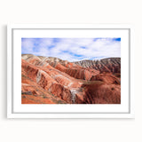 Abstract art print featuring swirling blue and white patterns on a framed canvas, suitable for bedroom or dining room decor.