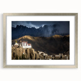 Textured art print depicting abstract Tibetan scenery in earthy tones on a framed silver mat, ideal for bedroom art.