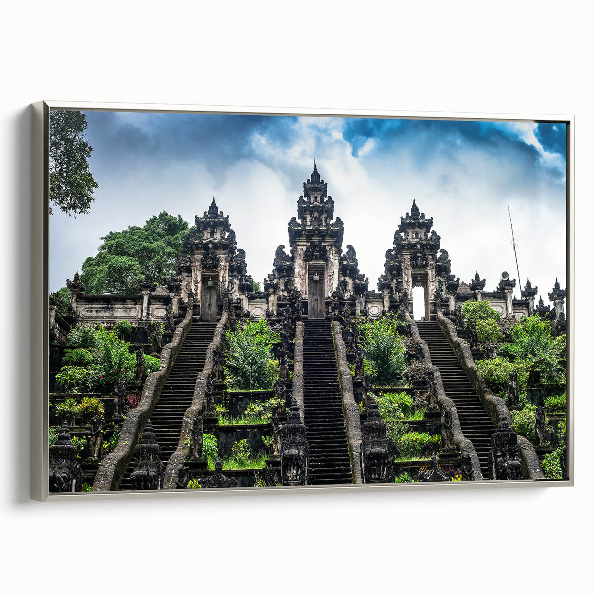 Framed canvas featuring a vintage-style landscape painting of an Indonesian scenery in colorful tones.
