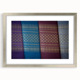 Textured art depicting an abstract scenery of Laos in muted earth tones on a framed silver mat, ideal for bedroom art.