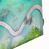 Large abstract wall art of the Maldives seascape in muted blue and green tones on acrylic glass.