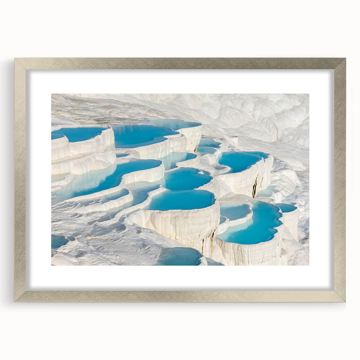 Textured abstract art print of a Turkish landscape in muted earth tones, framed in silver, ideal for bedroom art.