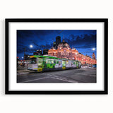 Extra large abstract art print of Melbourne skyline in vibrant colors on textured canvas, framed in black.