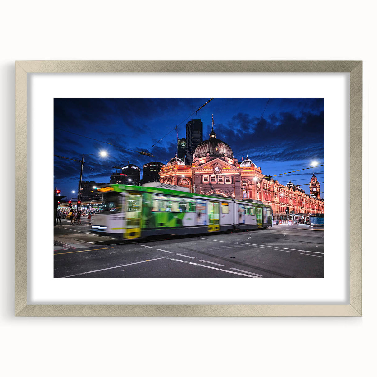 Abstract art print of Melbourne skyline in muted gray and blue tones on a silver-framed matte canvas.