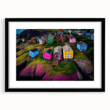Abstract art print depicting vibrant, colorful scenery of Newfoundland, in a black frame with mat.