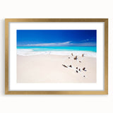 Abstract art print depicting Caribbean scenery in muted blue and green tones on a framed canvas.