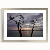 Extra large abstract art print of a Caribbean scenery in muted blue and green, framed in silver, ideal for living room decor.