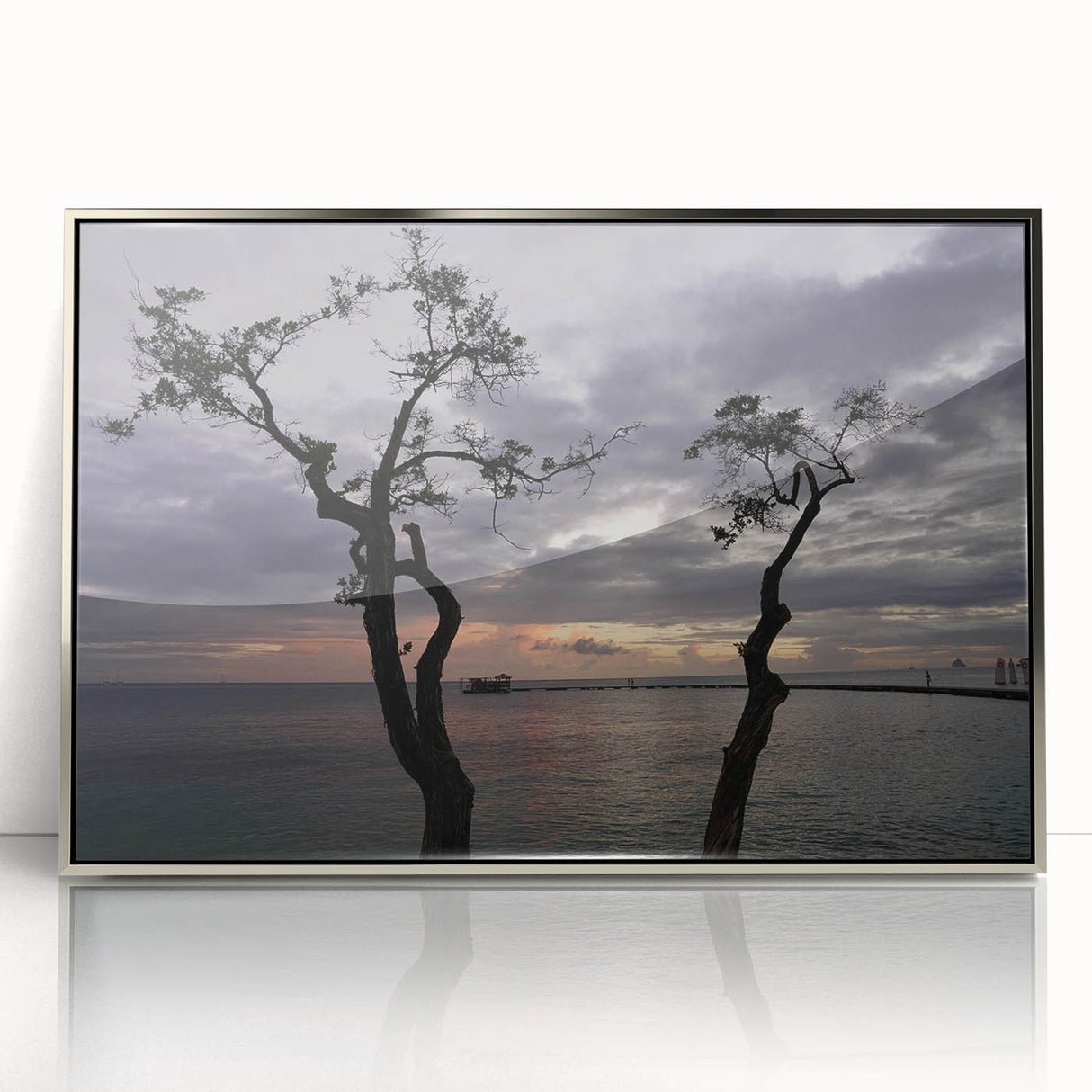 Art deco poster featuring a palm-fringed Caribbean beach in muted aqua and sand tones, framed in silver acrylic.