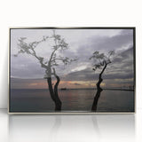 Art deco poster featuring a palm-fringed Caribbean beach in muted aqua and sand tones, framed in silver acrylic.