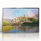 Large art print of a serene Austrian landscape in muted greens and blues, framed in silver acrylic.