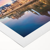 Art deco poster of a European cityscape in muted colors on rolled canvas, suitable for dining room decor.