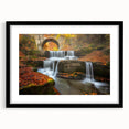 Extra large abstract art print of a colorful European scenery on textured canvas, framed in black.