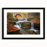 Extra large abstract art print of a colorful European scenery on textured canvas, framed in black.
