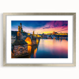 Extra large abstract art print depicting a textured Prague scenery in muted colors, framed in silver.