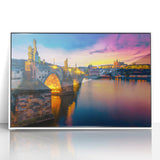 Mid-century modernist Prague cityscape on white framed acrylic, featuring muted earth tones, ideal for nursery wall art.