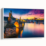 Vintage poster art of Prague on a framed canvas, featuring colorful imagery on a black background.