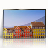 Large art print of a European cityscape in muted gray and blue tones on a silver-framed acrylic.