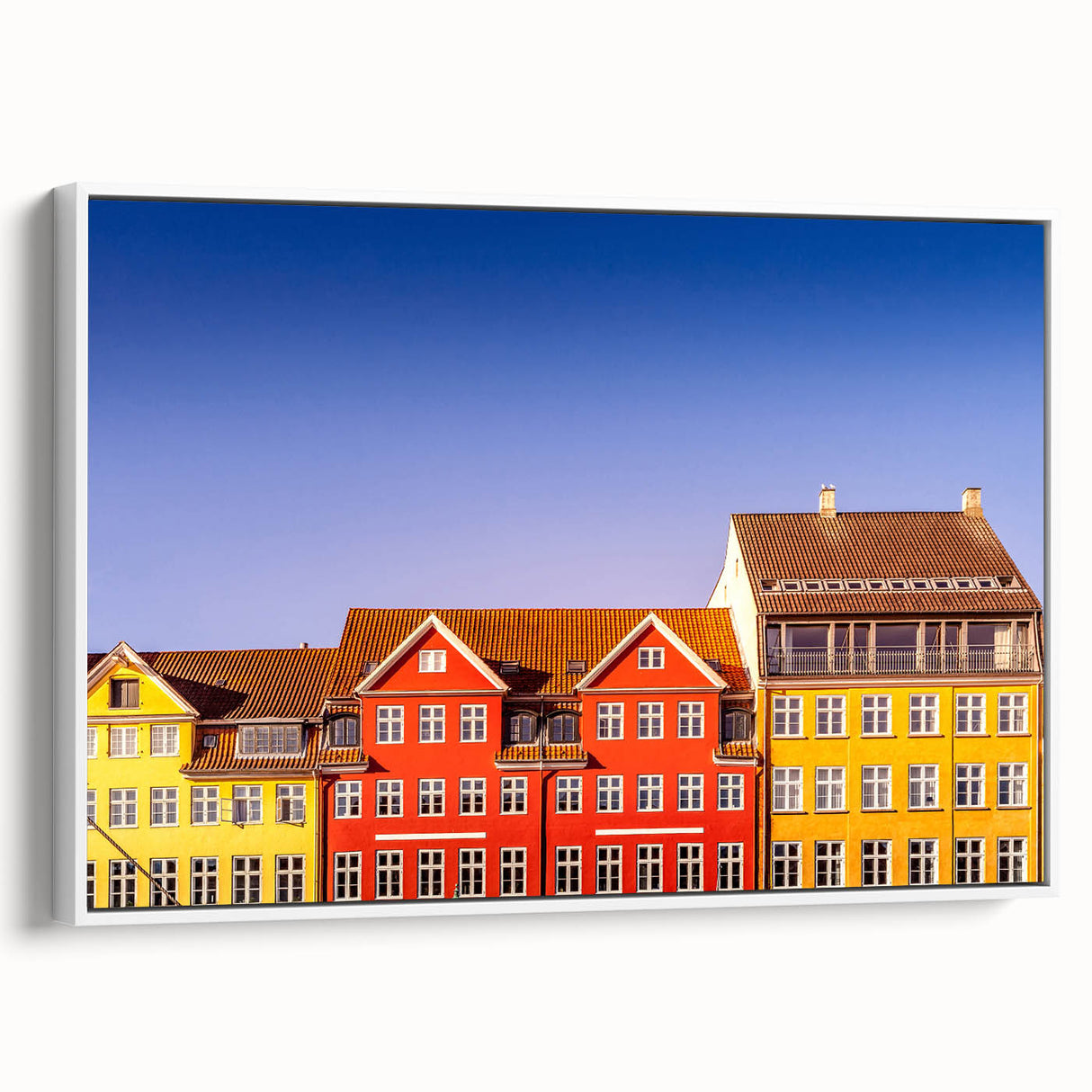 Vintage poster art of a colorful European scenery on a large framed canvas, ideal for living room decor.