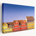 Side view of a stretched canvas depicting a serene Danish landscape in soft green and blue tones.