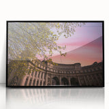 Large abstract wall art depicting a European cityscape in muted gray and blue tones, acrylic print in a black frame.