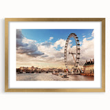 Abstract art print of London scenery in muted gold and blue tones, framed with a mat, suitable for dining room decor.