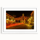 Textured art depicting an abstract European cityscape in muted earth tones on a framed white mat, ideal for bedroom decor.