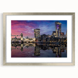 Extra large abstract art print of the Thames River in muted earth tones, framed in silver, ideal for living room decor.