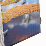 Large abstract wall art featuring a mid-century modernist design of Estonia scenery in muted earth tones on acrylic glass.