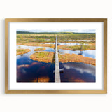 Abstract art print of a European cityscape in muted blues and grays, framed in gold, ideal for dining room decor.