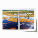 Rolled print of a serene Estonian landscape with lush greenery and a calm lake, ideal for dining room wall art.