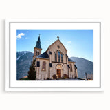 Textured art depicting abstract French Alps in muted earth tones on a framed white mat, ideal for bedroom decor.