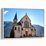 Vintage poster art of French Alps on framed canvas with a color palette of deep blues and greens.