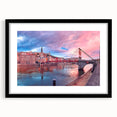 Colorful abstract art print of Lyon scenery in vibrant hues, framed with a black mat, ideal for living room decor.