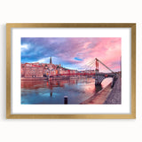 Abstract art print of Lyon scenery in muted gold and blue tones on a framed canvas, suitable for dining room decor.