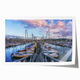 Rolled print of a Normandy, France scenery with soft pastel floral designs.