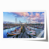 Rolled print of a Normandy, France scenery with soft pastel floral designs.