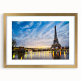 Abstract art print of Paris scenery in muted gold and gray tones, framed with a gold mat, suitable for dining room decor.