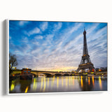 Vintage poster art of Paris skyline in vibrant colors on white framed canvas, ideal for living room decor.