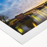 Art deco poster of Paris skyline in muted blue and tan tones on rolled canvas, suitable for dining room decor.