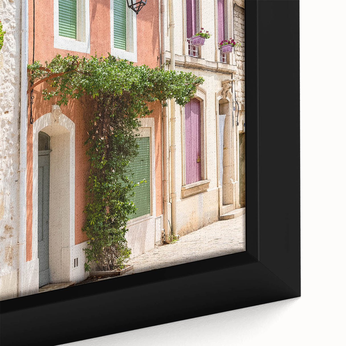 Black wall art featuring a textured, colorful abstract of southern France on a large framed canvas.