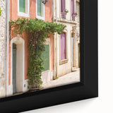 Black wall art featuring a textured, colorful abstract of southern France on a large framed canvas.