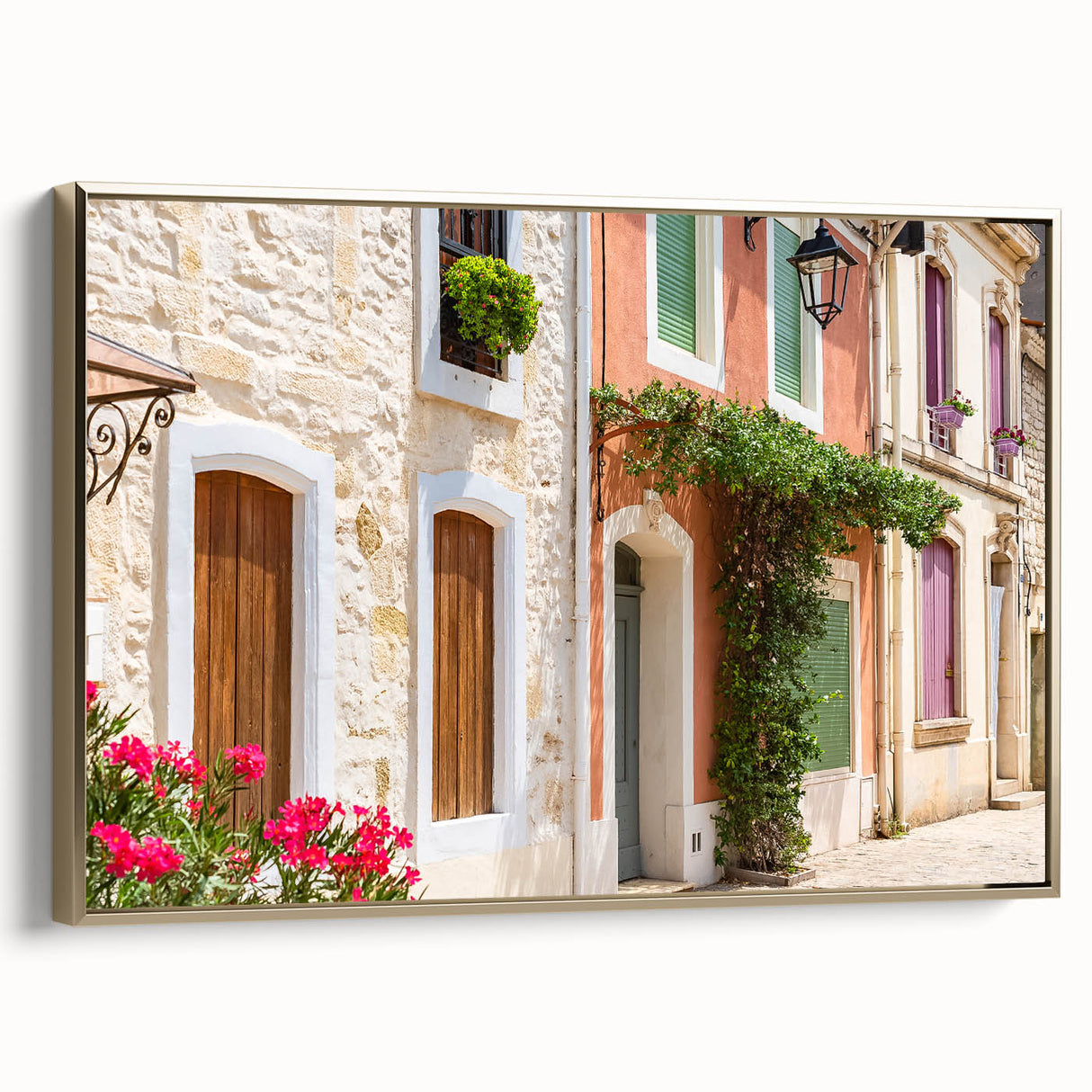 Framed canvas of a vintage-style landscape depicting the southern French countryside in muted earth tones.