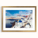 Abstract art print of Santorini with vibrant blue and white tones, framed in gold, suitable for dining room decor.