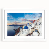 Textured art print of Santorini with abstract blue and white tones, framed with a white mat, suitable for bedroom decor.