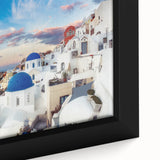 Black wall art depicting Santorini, Greece, on textured framed canvas with colorful accents.